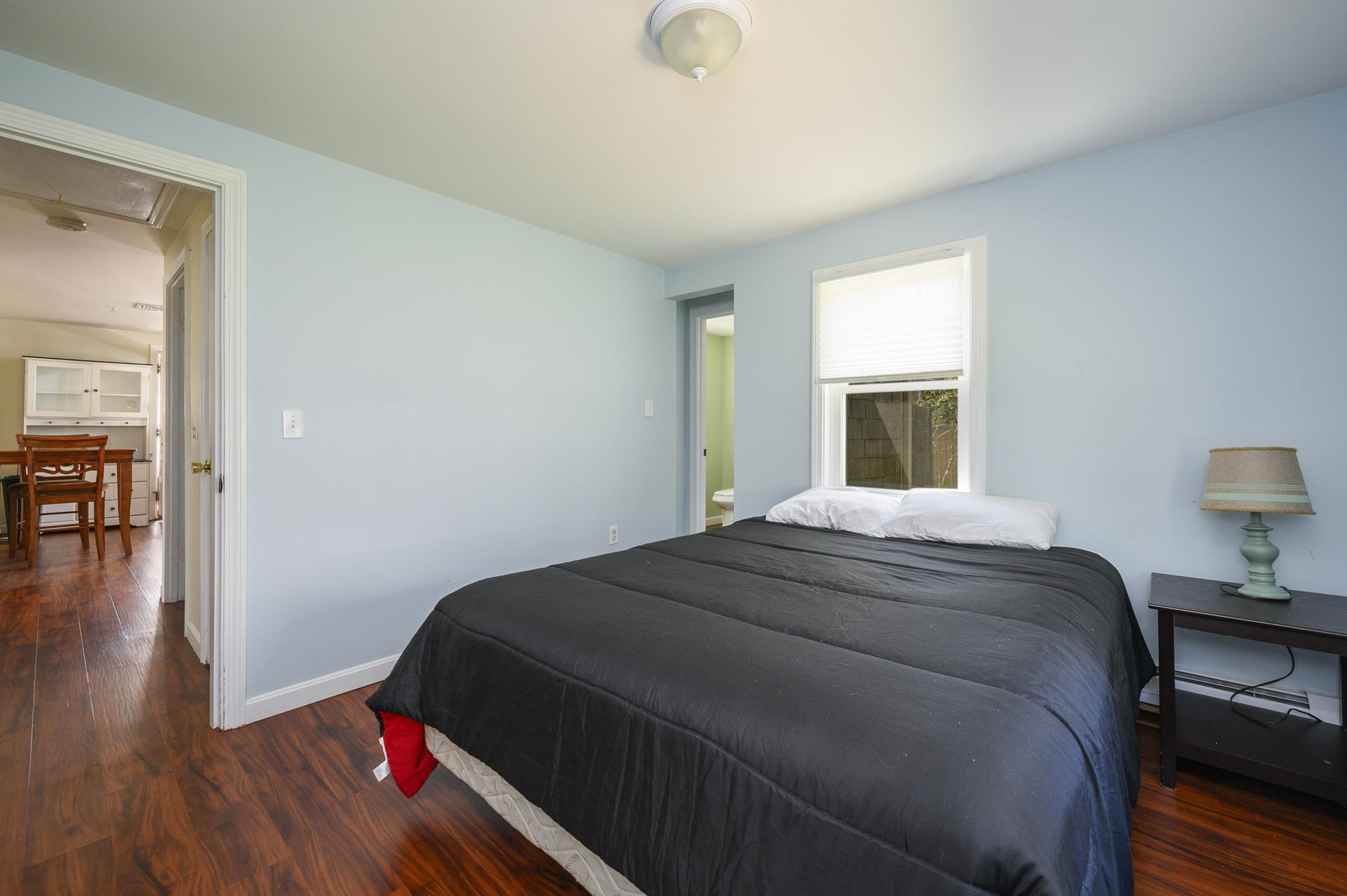 17 Farm Hill Road Centerville, MA 02632 - Photo 13 of 25 a bedroom with a bed and wooden floor