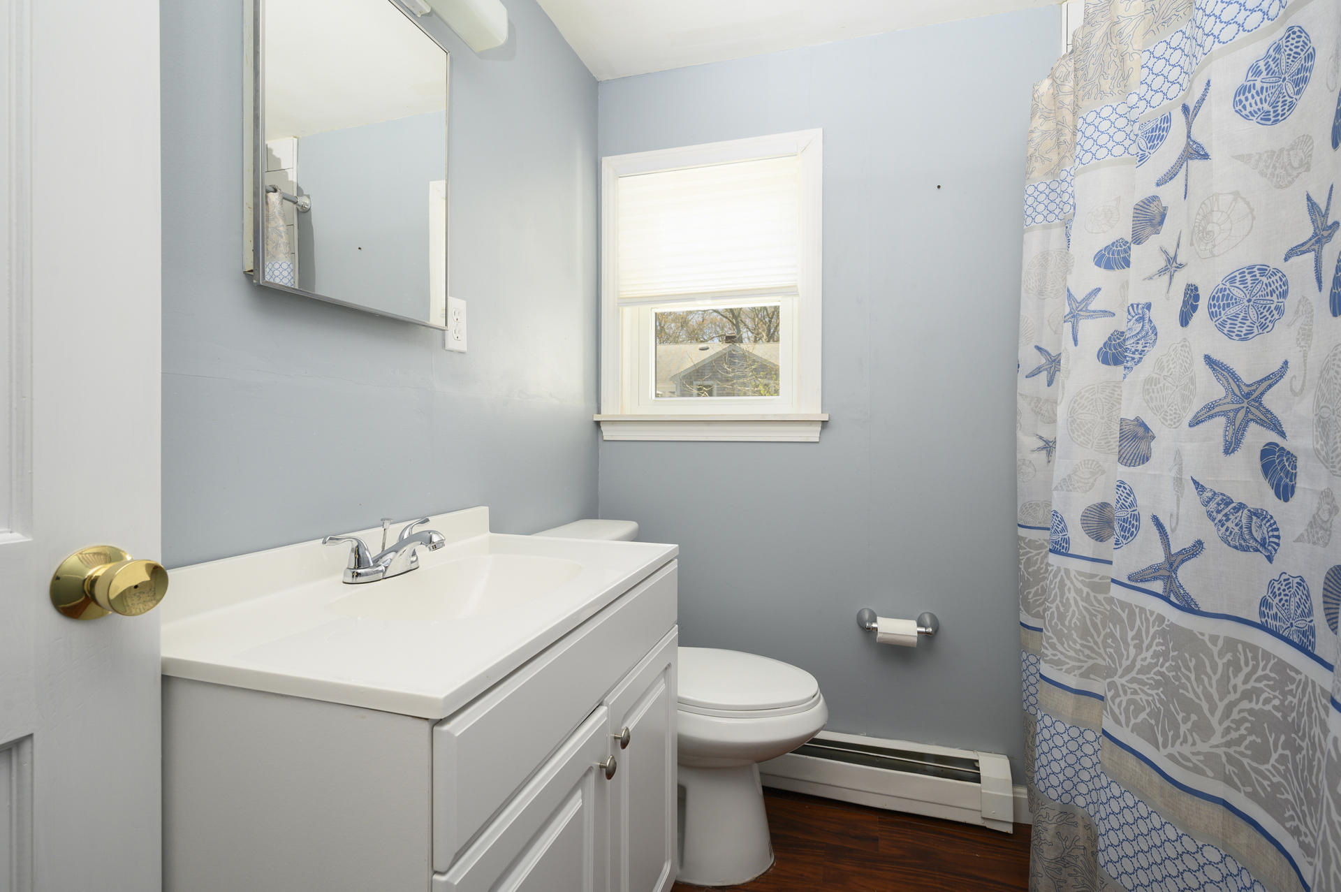 17 Farm Hill Road Centerville, MA 02632 - Photo 16 of 25 a bathroom with a sink a toilet and vanity