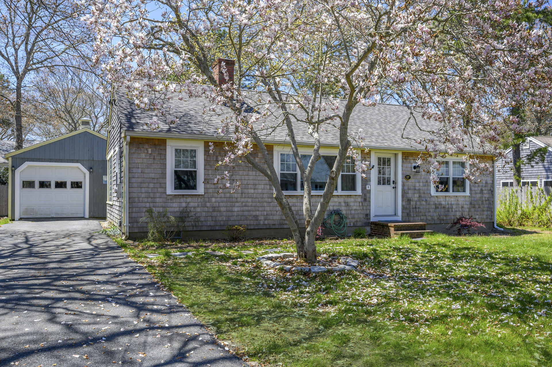 17 Farm Hill Road Centerville, MA 02632 - Photo 2 of 25 a front view of a house with a yard