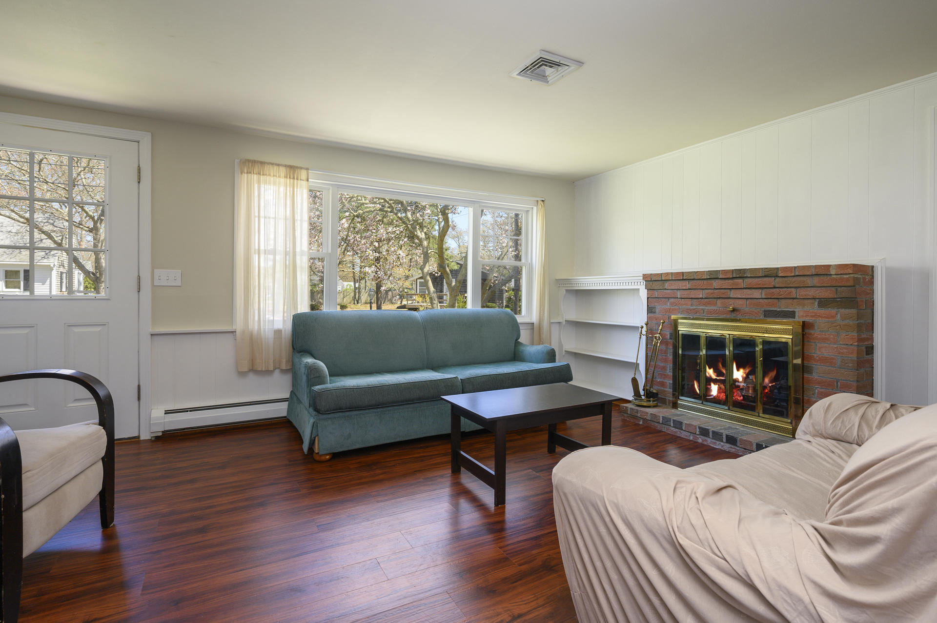 17 Farm Hill Road Centerville, MA 02632 - Photo 4 of 25 a living room with furniture and a fireplace