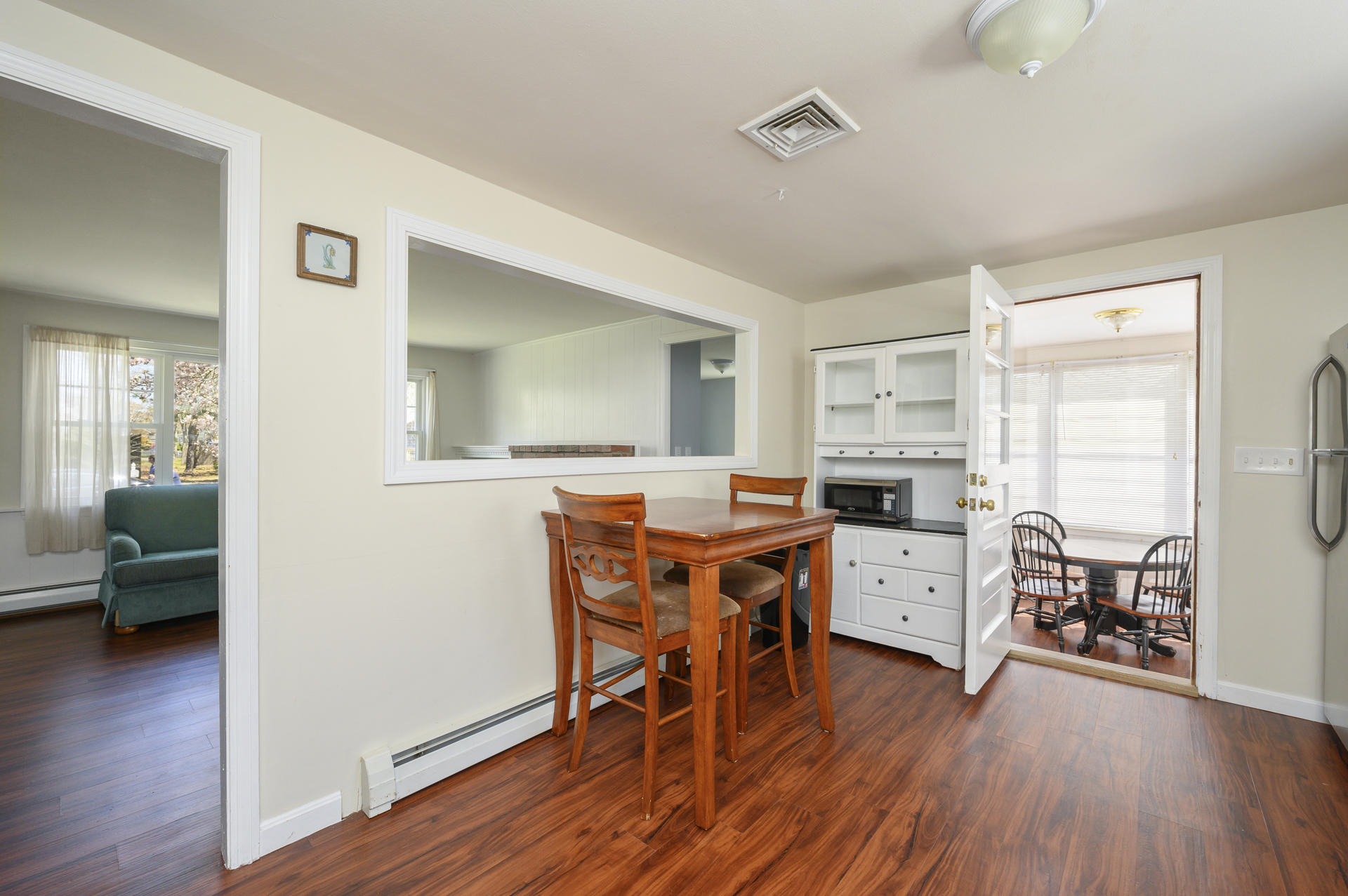 17 Farm Hill Road Centerville, MA 02632 - Photo 7 of 25 a view of a dining room with furniture and wooden floor