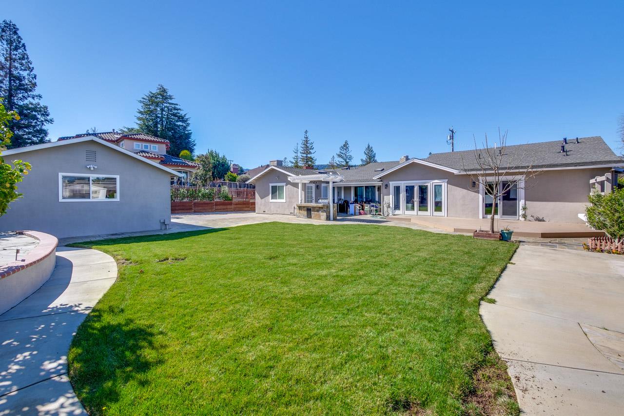 21972 McClellan Road Cupertino, CA 95014 - Photo 7 of 15 a view of a house with a yard