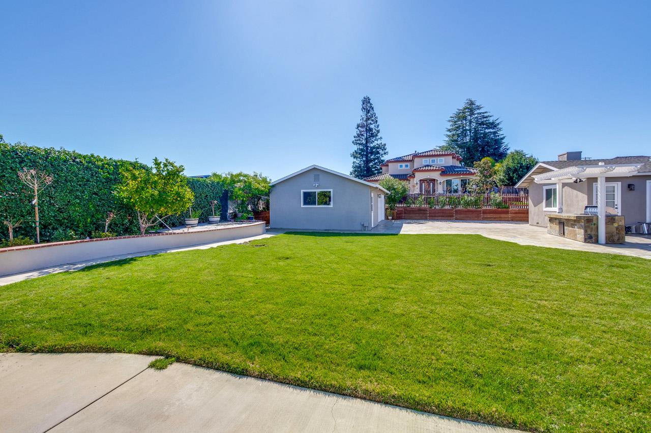 21972 McClellan Road Cupertino, CA 95014 - Photo 10 of 15 a front view of a house with garden