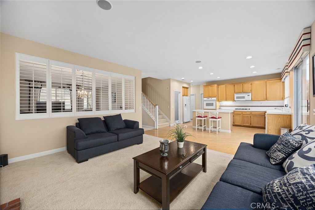 7343 Legacy Place Rancho Cucamonga, CA 91730 - Photo 12 of 53 a living room with furniture and a large window