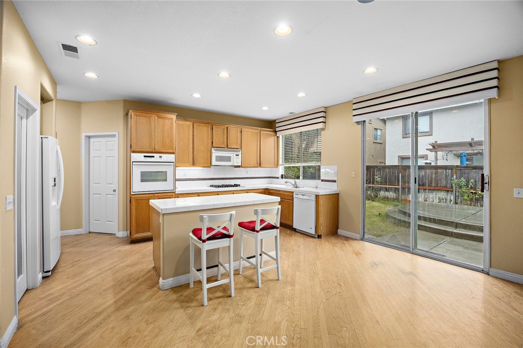 7343 Legacy Place Rancho Cucamonga, CA 91730 - Photo 13 of 53 a kitchen with a refrigerator and a sink