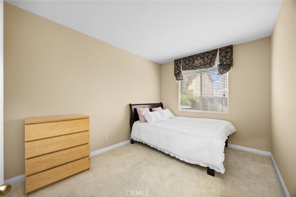 7343 Legacy Place Rancho Cucamonga, CA 91730 - Photo 18 of 53 a bedroom with a bed and a dresser