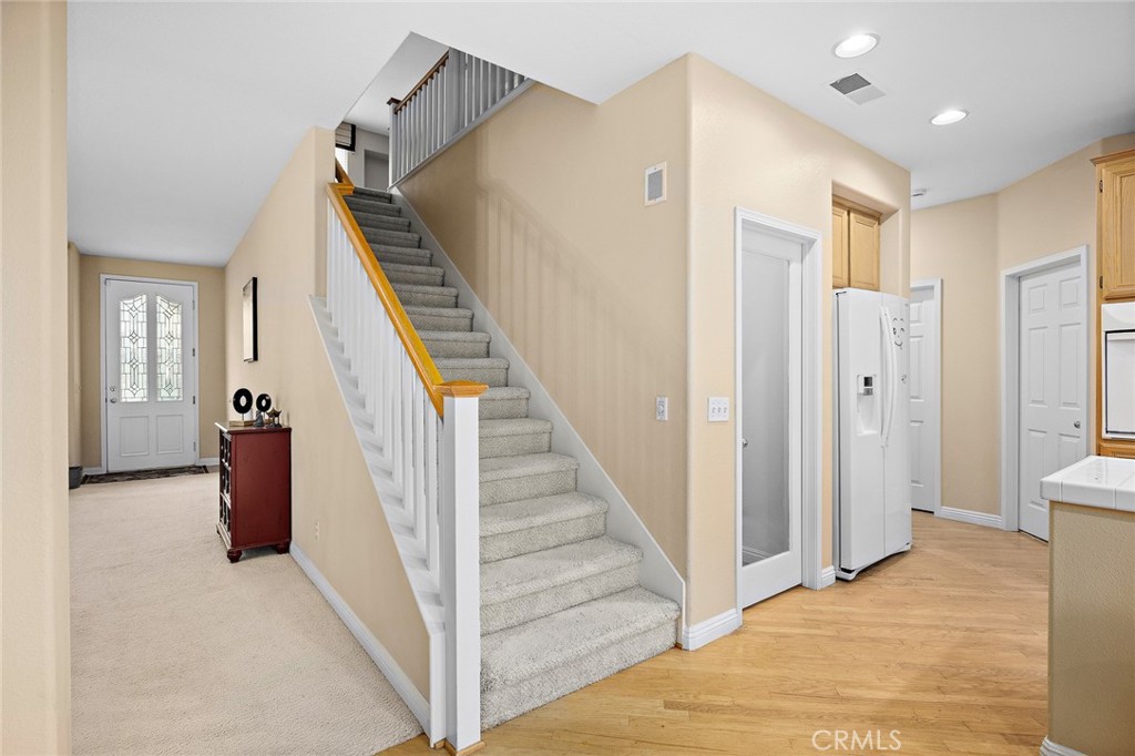 7343 Legacy Place Rancho Cucamonga, CA 91730 - Photo 20 of 53 a view of entryway with furniture and wooden floor