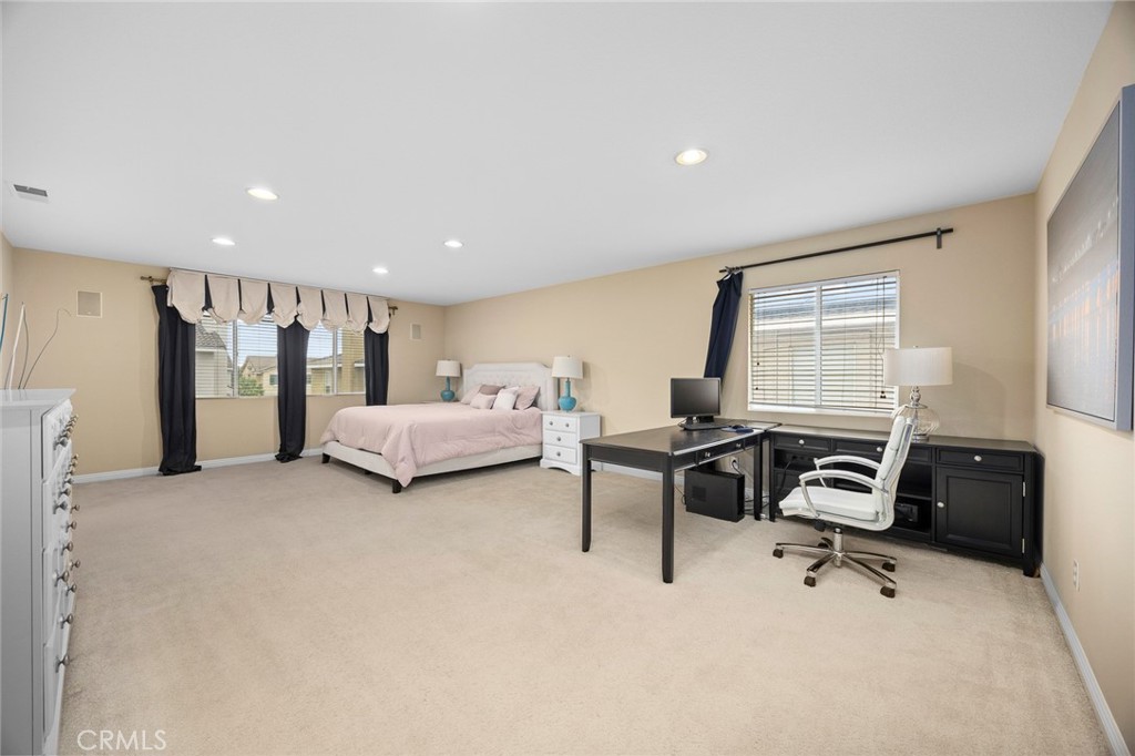 7343 Legacy Place Rancho Cucamonga, CA 91730 - Photo 24 of 53 a bedroom with furniture and a window