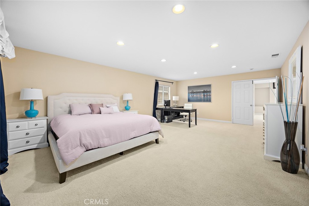 7343 Legacy Place Rancho Cucamonga, CA 91730 - Photo 26 of 53 a spacious bedroom with a bed and a couch
