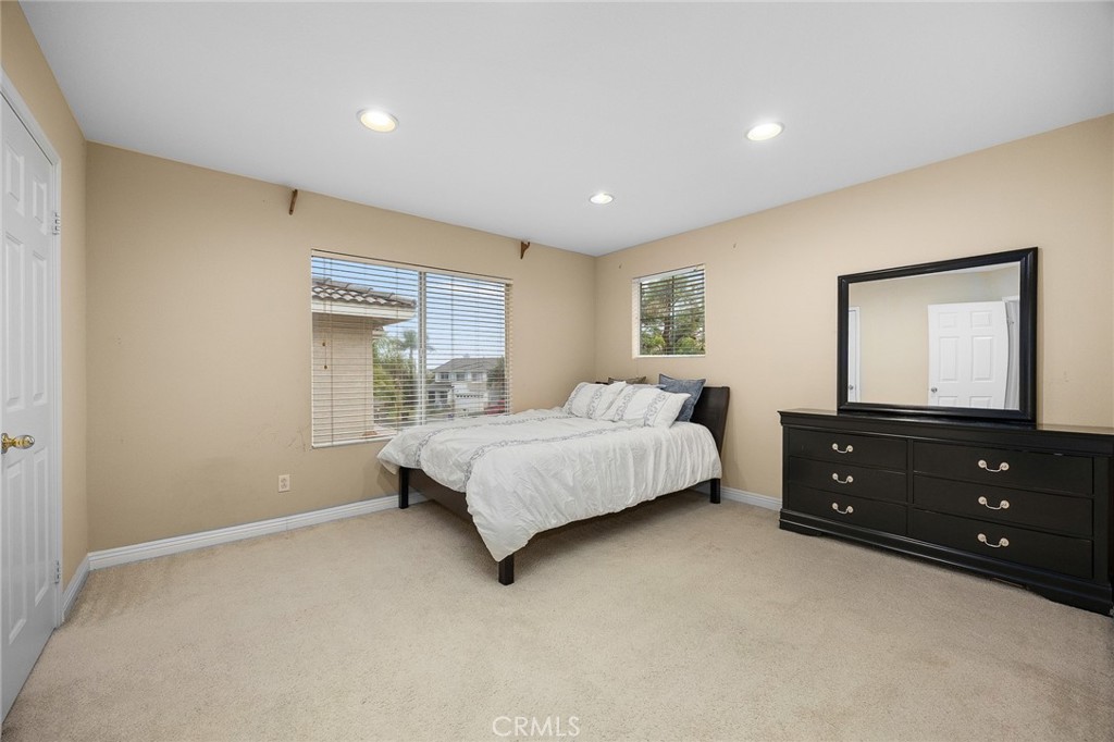 7343 Legacy Place Rancho Cucamonga, CA 91730 - Photo 30 of 53 a bedroom with a bed and a night stand