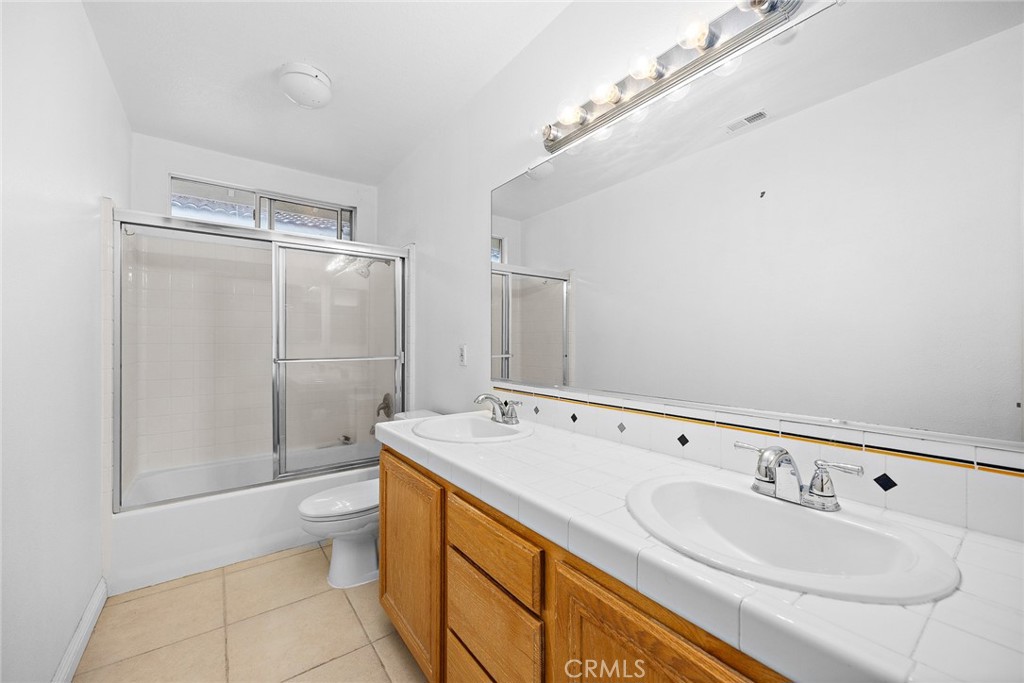 7343 Legacy Place Rancho Cucamonga, CA 91730 - Photo 32 of 53 a bathroom with a sink a toilet and shower