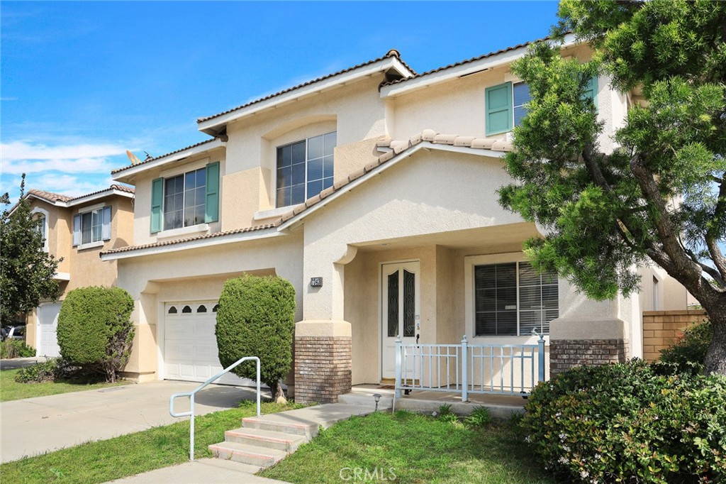 7343 Legacy Place Rancho Cucamonga, CA 91730 - Photo 4 of 53 front view of a house with a yard