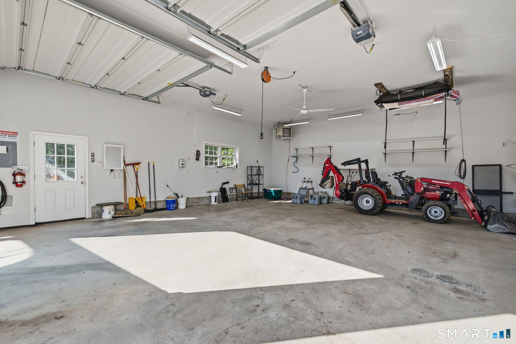 141 Hop River Road Coventry, CT 06238 - Photo 37 of 40 a view of a garage with a bike and car