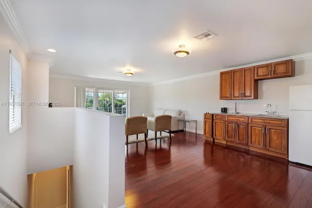 a view of kitchen and dining room with wooden floor