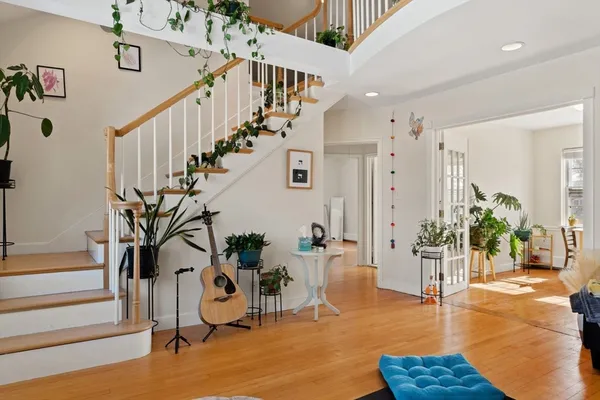 a view of a livingroom with furniture and stairs