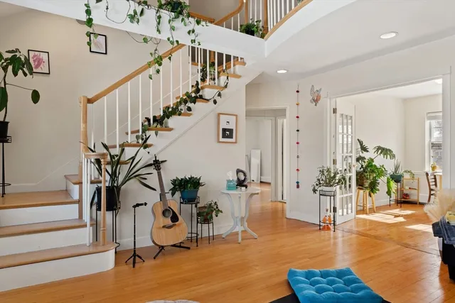 a view of a livingroom with furniture and stairs