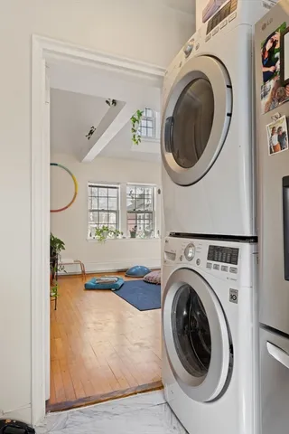 a view of a hallway with washer and dryer