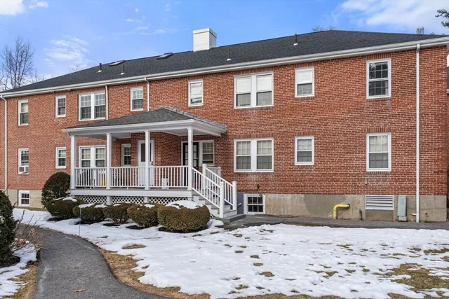 a view of a yard with snow on the road