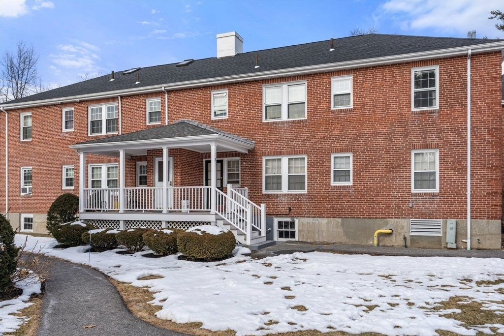 76 Boylston Street, Unit 4 Newton, MA 02467 - Photo 13 of 14 a front view of a house with a yard