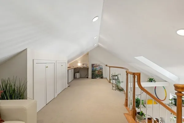 a view of a hallway with staircase