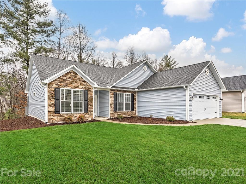 146 Grove End Road Fletcher, NC 28732 - Photo 22 of 22 a front view of a house with a yard and garage