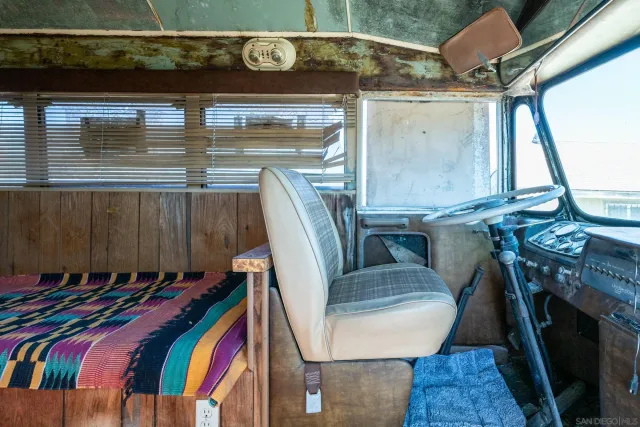 a view of a dining room with furniture and window