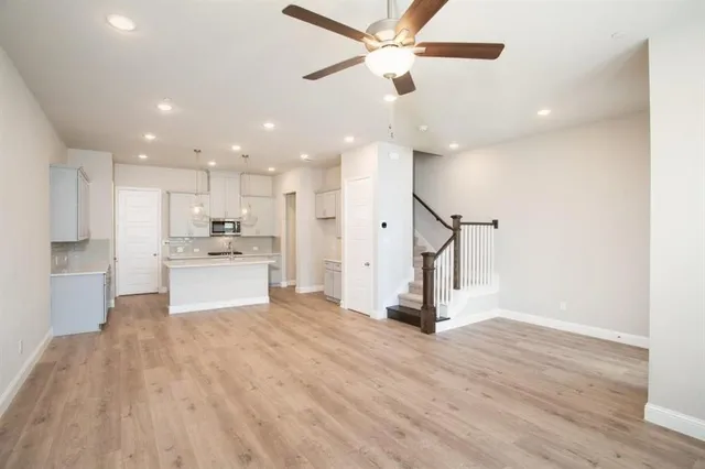 a view of kitchen and refrigerator