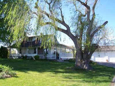 9903 Zier Road Yakima, WA 98908 - Photo 1 of 10 a front view of a house with a yard