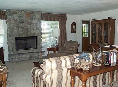 9903 Zier Road Yakima, WA 98908 - Photo 5 of 10 a living room with furniture a fireplace and a flat screen tv