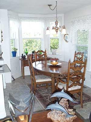 9903 Zier Road Yakima, WA 98908 - Photo 6 of 10 a dining room filled chandelier and wooden floor