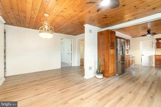 a white bath tub sitting next to a white house