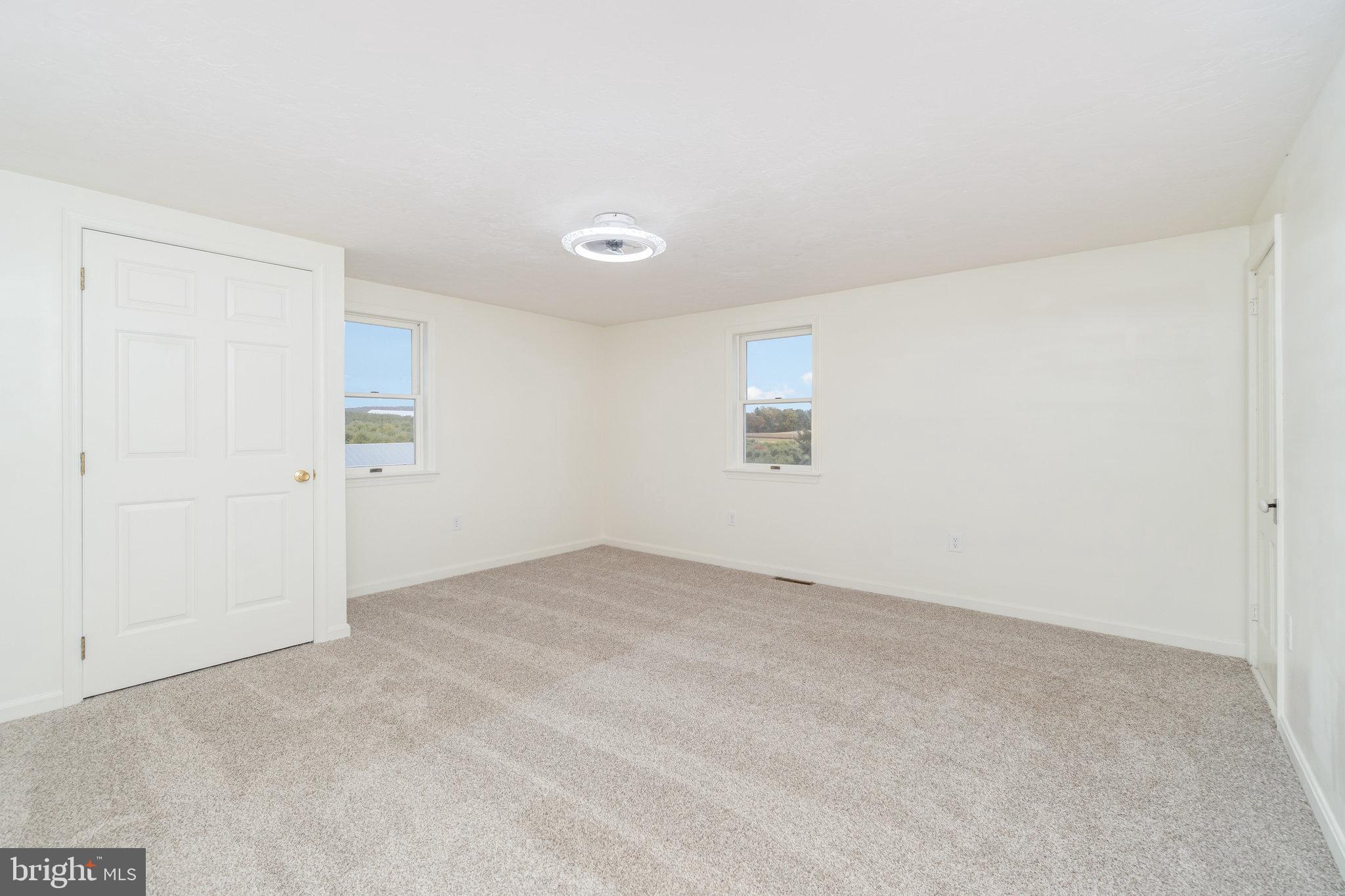 502 Celebration Hill Road Biglerville, PA 17307 - Photo 19 of 67 an empty room with a empty space and windows