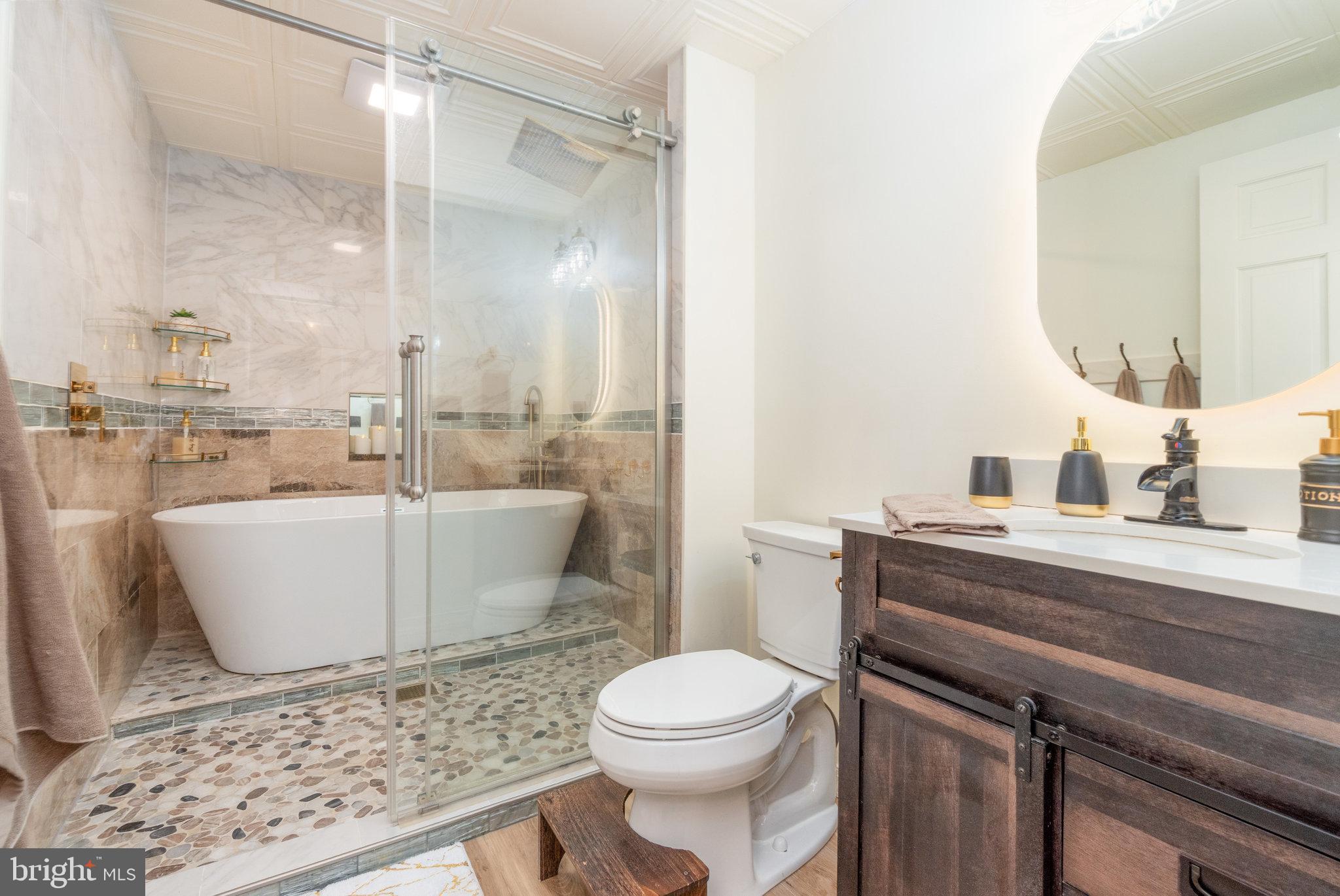 502 Celebration Hill Road Biglerville, PA 17307 - Photo 21 of 67 a bathroom with a toilet a sink and a mirror