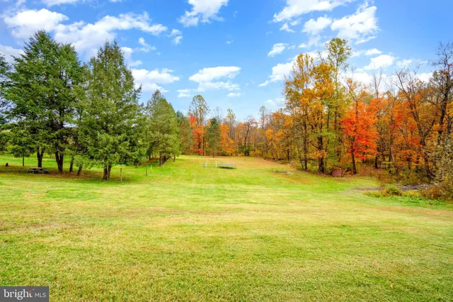 a view of an empty room with a fireplace