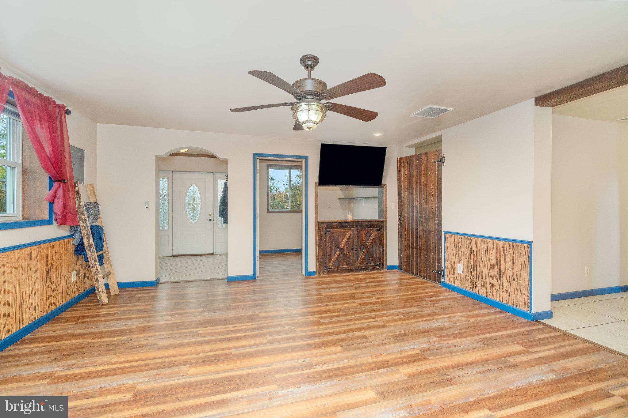 502 Celebration Hill Road Biglerville, PA 17307 - Photo 42 of 67 a view of an empty room with window and wooden floor