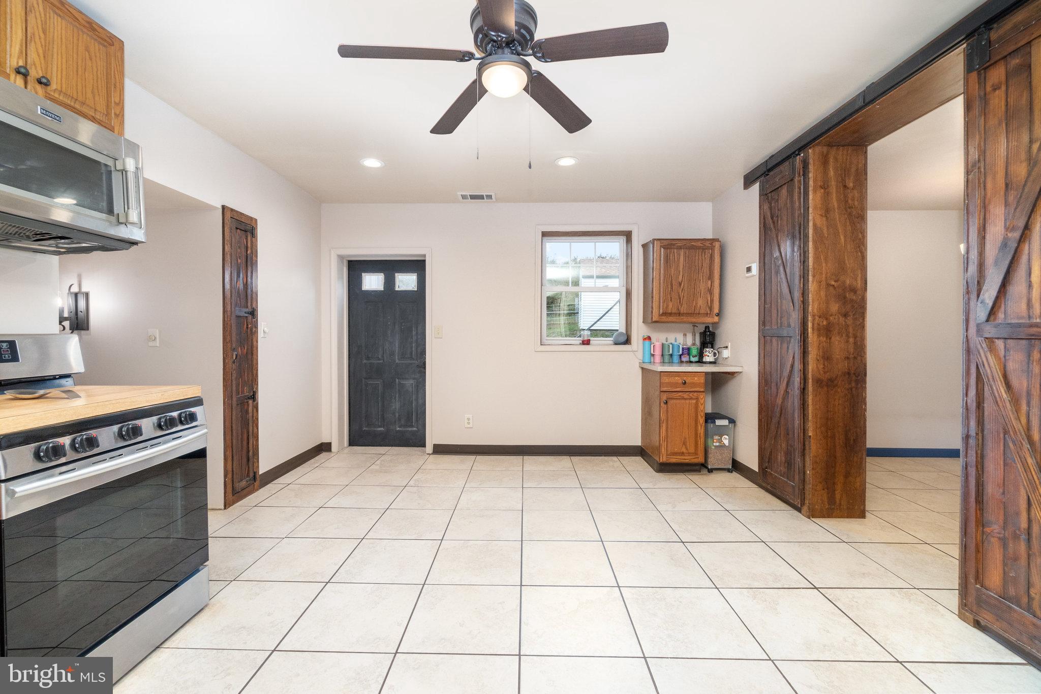 502 Celebration Hill Road Biglerville, PA 17307 - Photo 46 of 67 a kitchen with a stove a refrigerator and cabinets