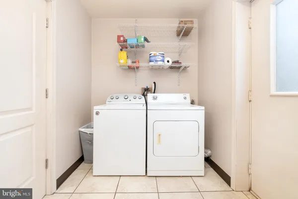 a picture of a bench in front of a wall