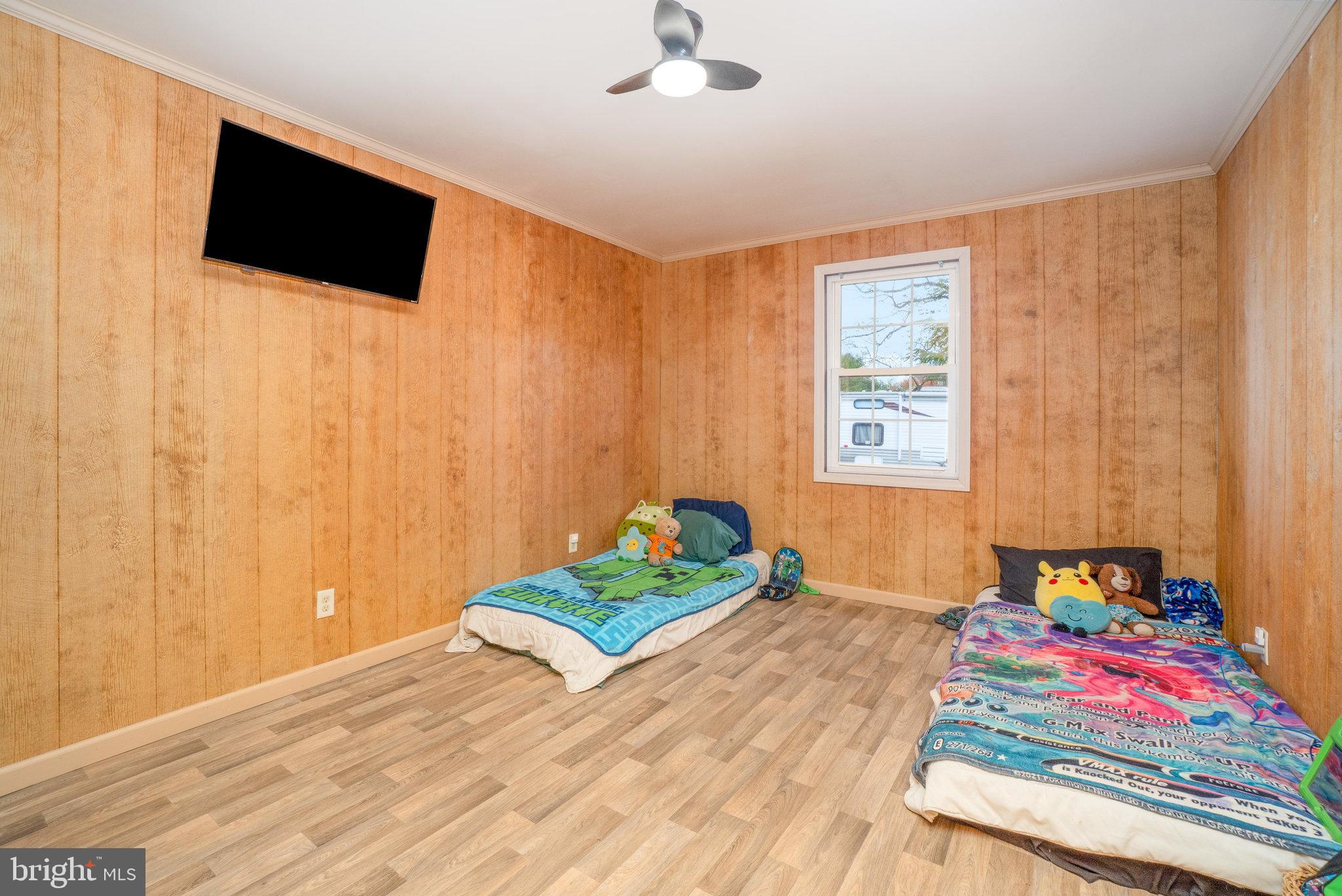 502 Celebration Hill Road Biglerville, PA 17307 - Photo 53 of 67 a bedroom with a bed and a flat screen tv