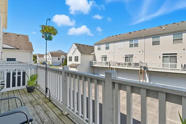 a view of a balcony with chairs