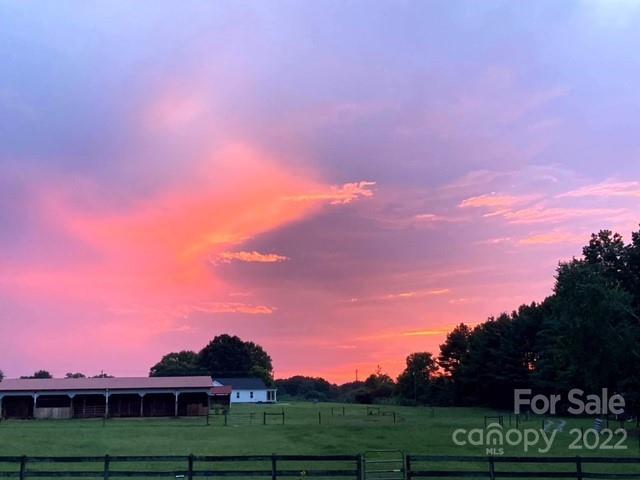 1825 Emanuel Church Road Rockwell, NC 28138 - Photo 12 of 21 a view of a big yard with a houses in the back