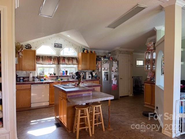1825 Emanuel Church Road Rockwell, NC 28138 - Photo 18 of 21 a kitchen with stainless steel appliances granite countertop a stove refrigerator and cabinets