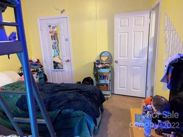1825 Emanuel Church Road Rockwell, NC 28138 - Photo 20 of 21 a bedroom with a bed and a window