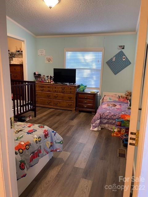 1825 Emanuel Church Road Rockwell, NC 28138 - Photo 9 of 21 a bedroom with a bed and wooden floor