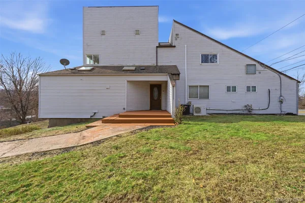 a view of a backyard of the house