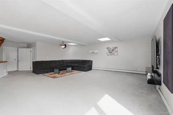 a view of entryway and hall with wooden floor and stairs