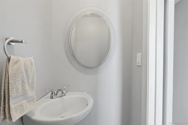 a bedroom with a bed a window and dresser