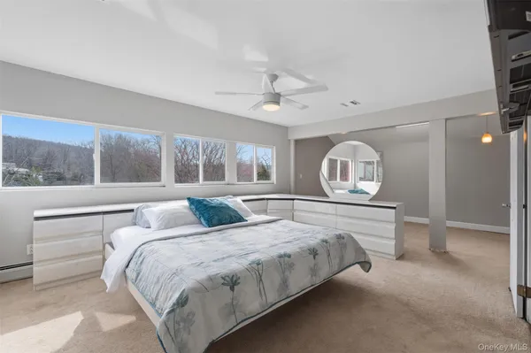 a bedroom with a large bed and a window