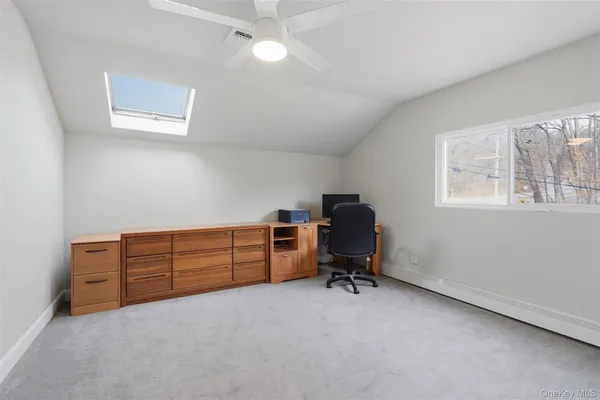 a view of a livingroom and a workspace