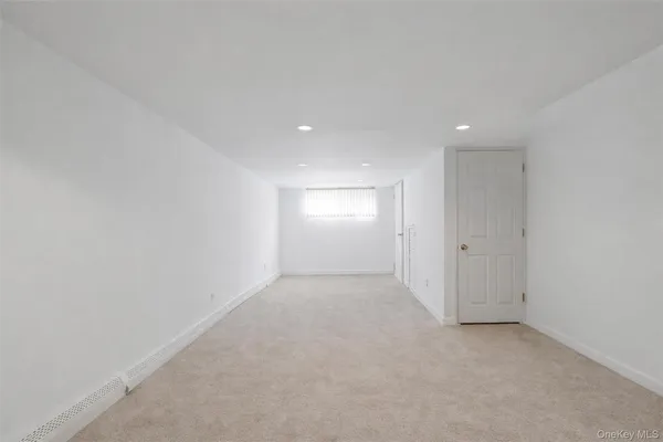 a view of a livingroom with furniture and stairs