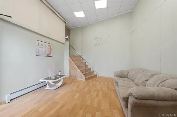 a room with stairs and a wooden floor